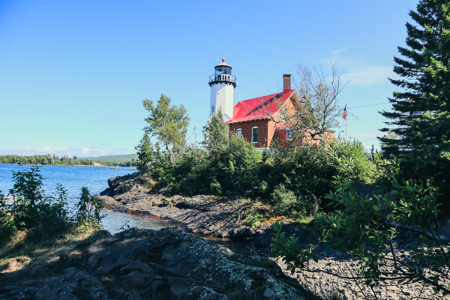 Eagle Harbor Lighthouse on a rocky point above Lake Superior